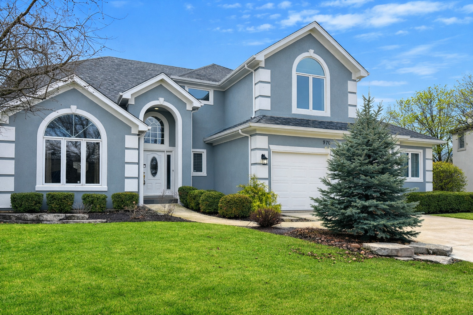 970 Waterside Court Aurora, IL 60502 - Photo 2 of 42 a front view of a house with a yard and garage