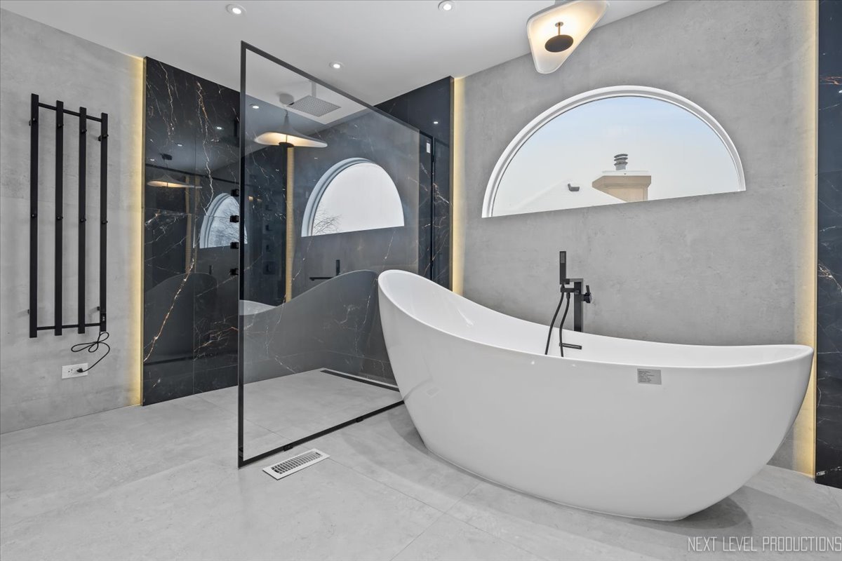 970 Waterside Court Aurora, IL 60502 - Photo 26 of 42 a white bath tub sitting in a bathroom