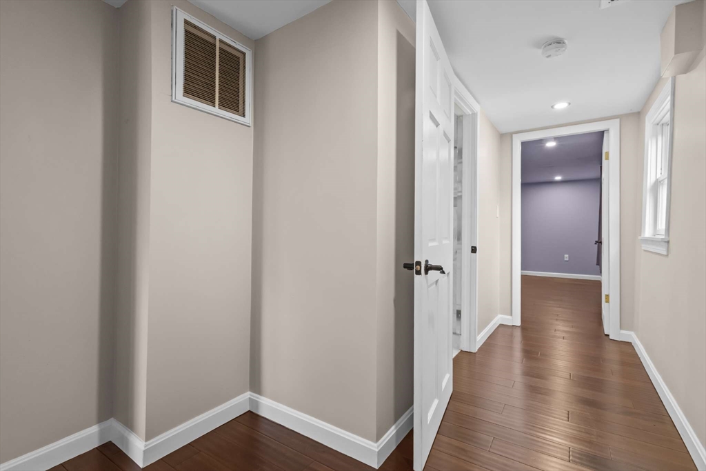 7 Darrow Street Worcester, MA 01606 - Photo 25 of 42 a view of a hallway with wooden floor