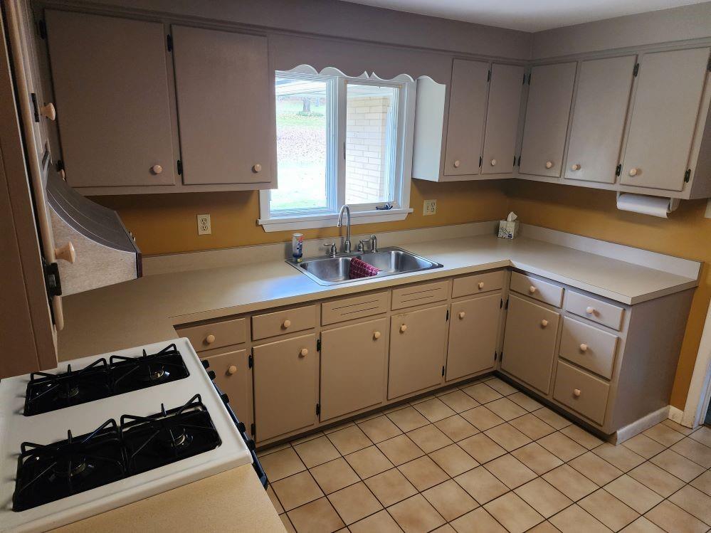 427 Lutz School Road Indiana, PA 15701 - Photo 4 of 15 a kitchen with a cabinets and a stove top oven