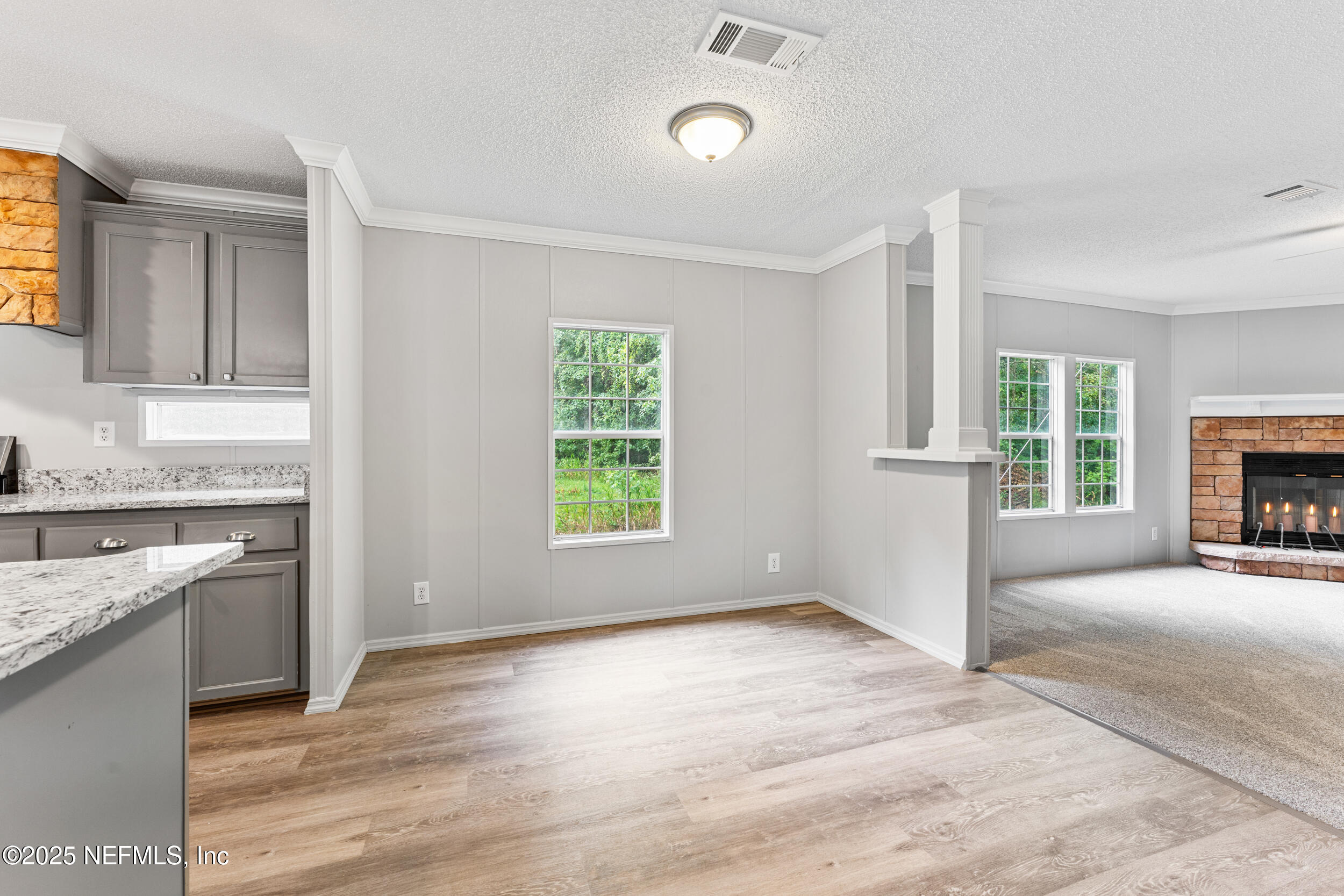 37341 Old Pineridge Road Hilliard, FL 32046 - Photo 11 of 27 a view of an empty room with a kitchen and a window