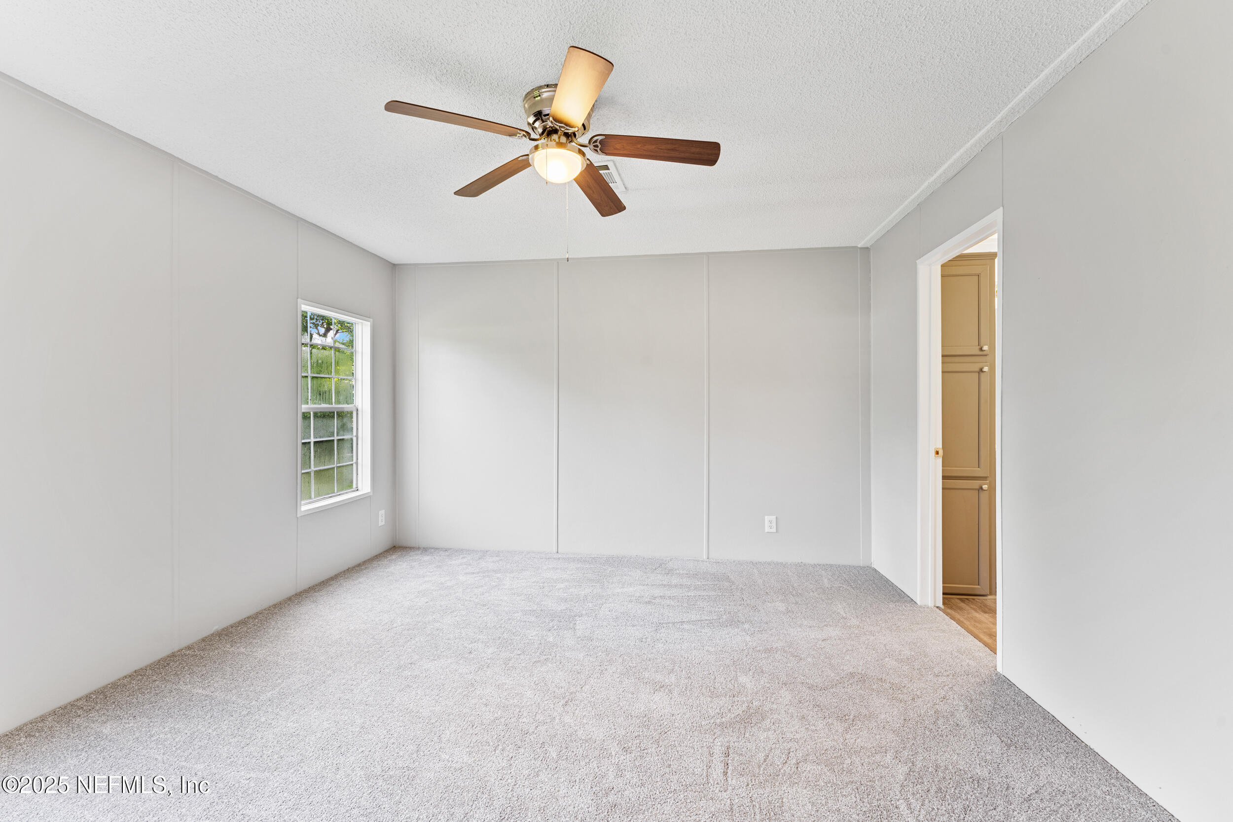 37341 Old Pineridge Road Hilliard, FL 32046 - Photo 18 of 27 a view of an empty room with a window