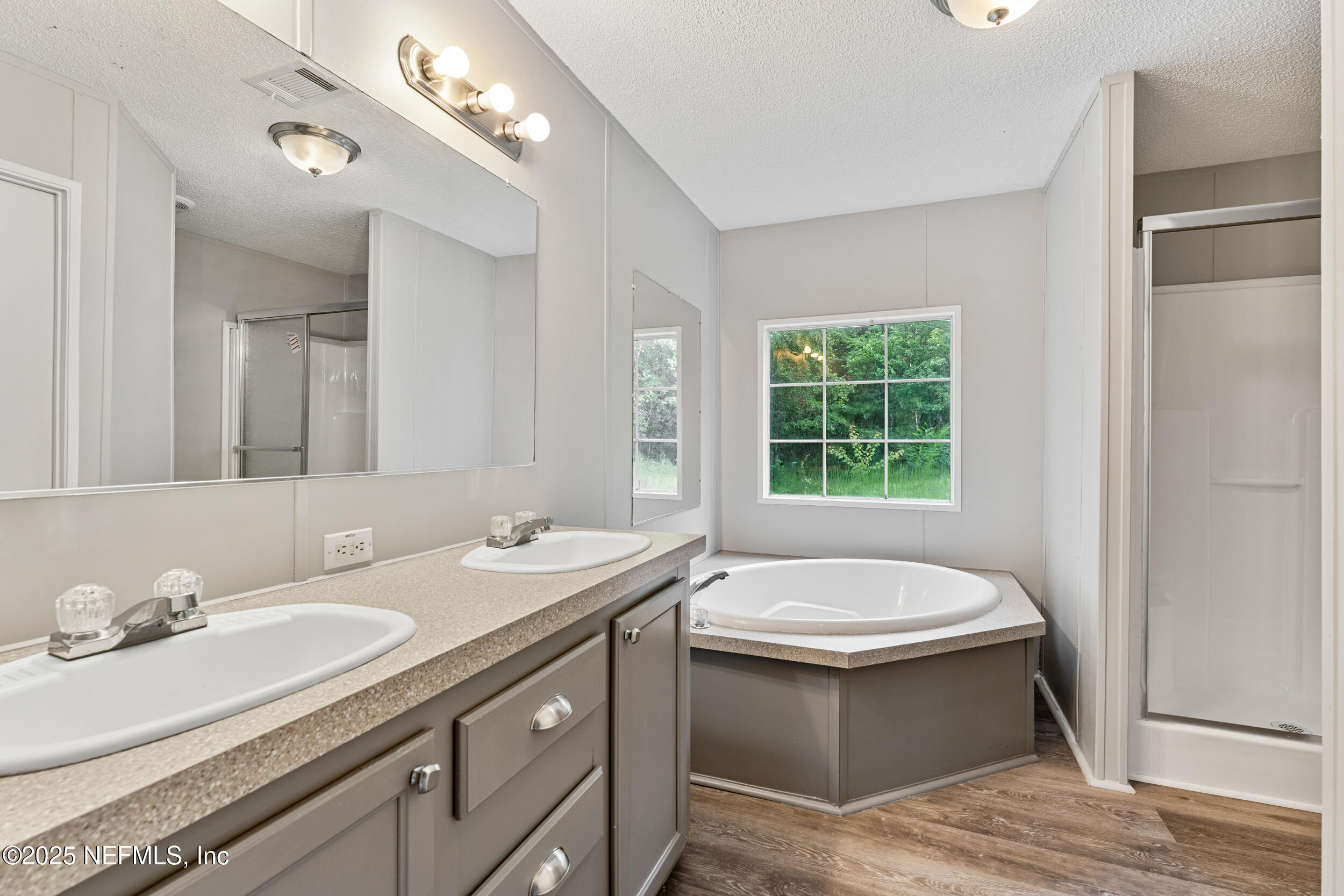 37341 Old Pineridge Road Hilliard, FL 32046 - Photo 19 of 27 a bathroom with a sink and a mirror