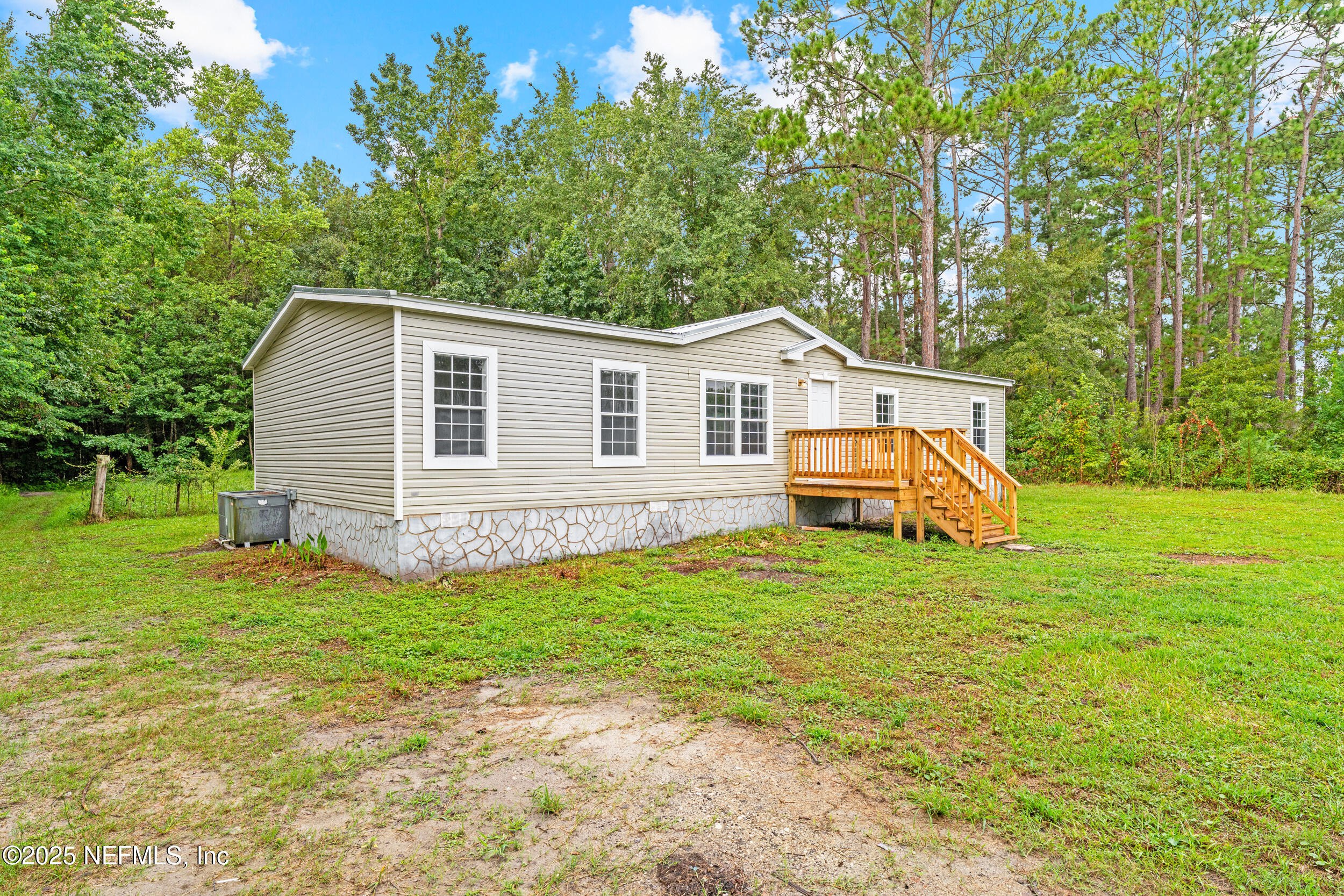 37341 Old Pineridge Road Hilliard, FL 32046 - Photo 2 of 27 a front view of a house with a yard