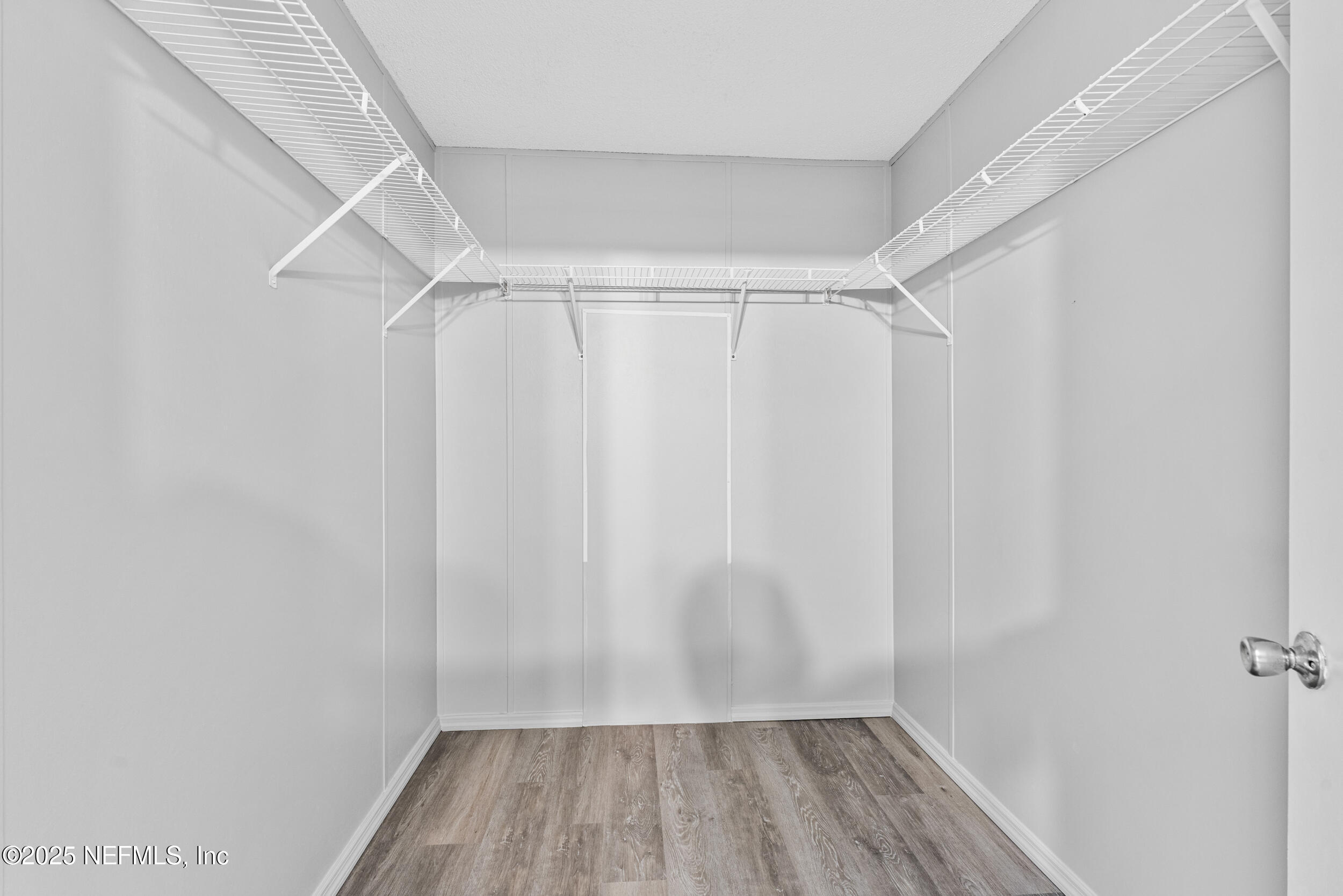 37341 Old Pineridge Road Hilliard, FL 32046 - Photo 21 of 27 a view of walk in closet with empty racks