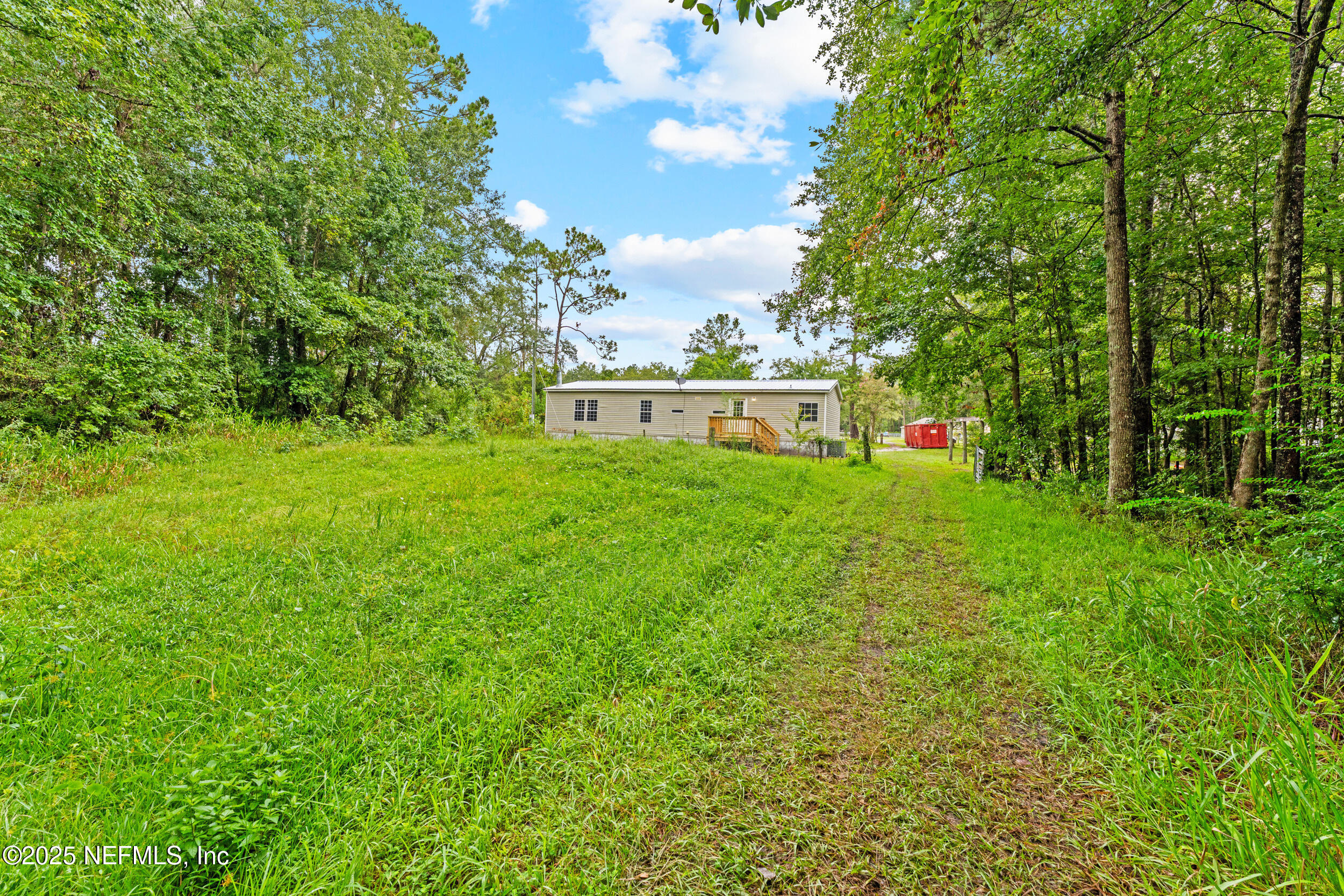 37341 Old Pineridge Road Hilliard, FL 32046 - Photo 25 of 27 a view of yard with grass and trees