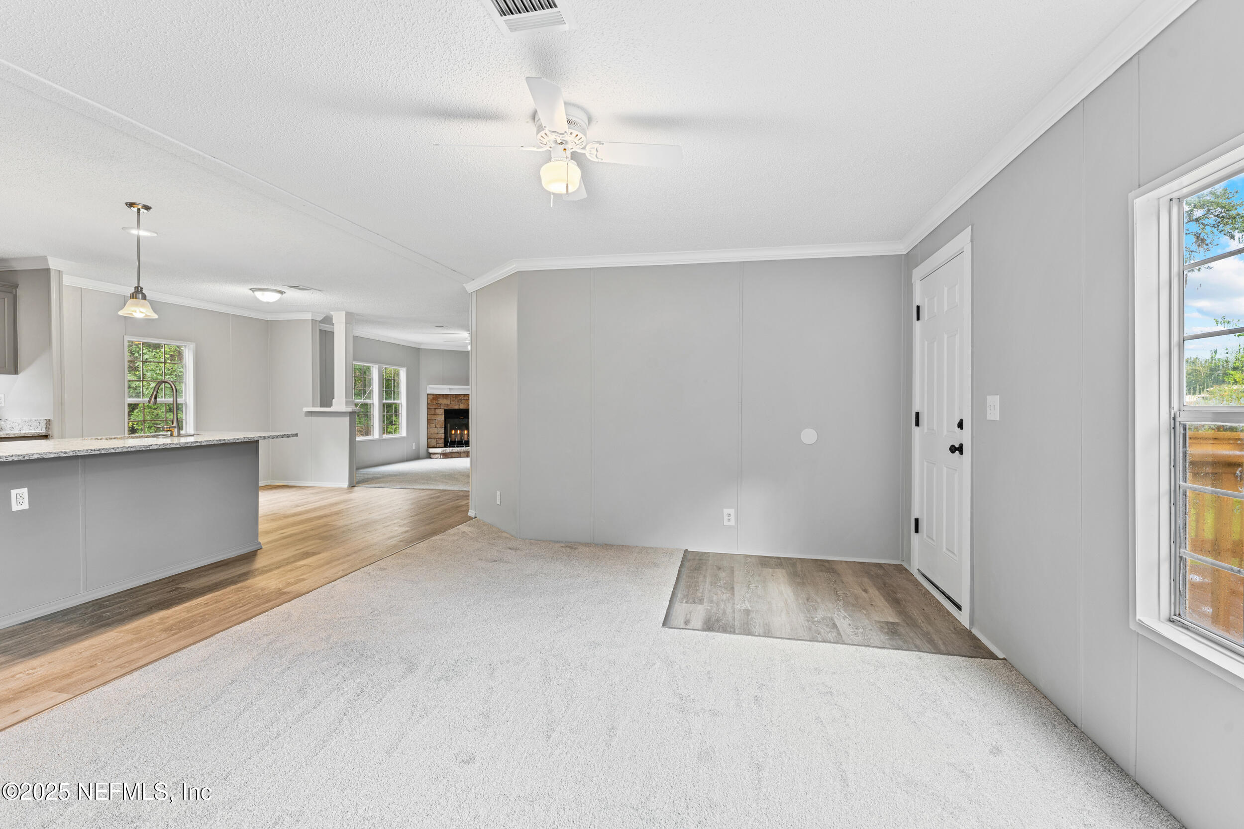 37341 Old Pineridge Road Hilliard, FL 32046 - Photo 6 of 27 an empty room with windows and entrance