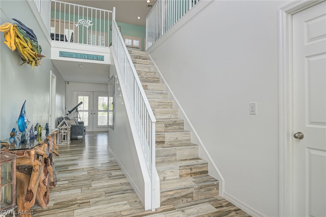 12614 River Road Fort Myers, FL 33905 - Photo 18 of 50 a view of entryway and hall with wooden floor