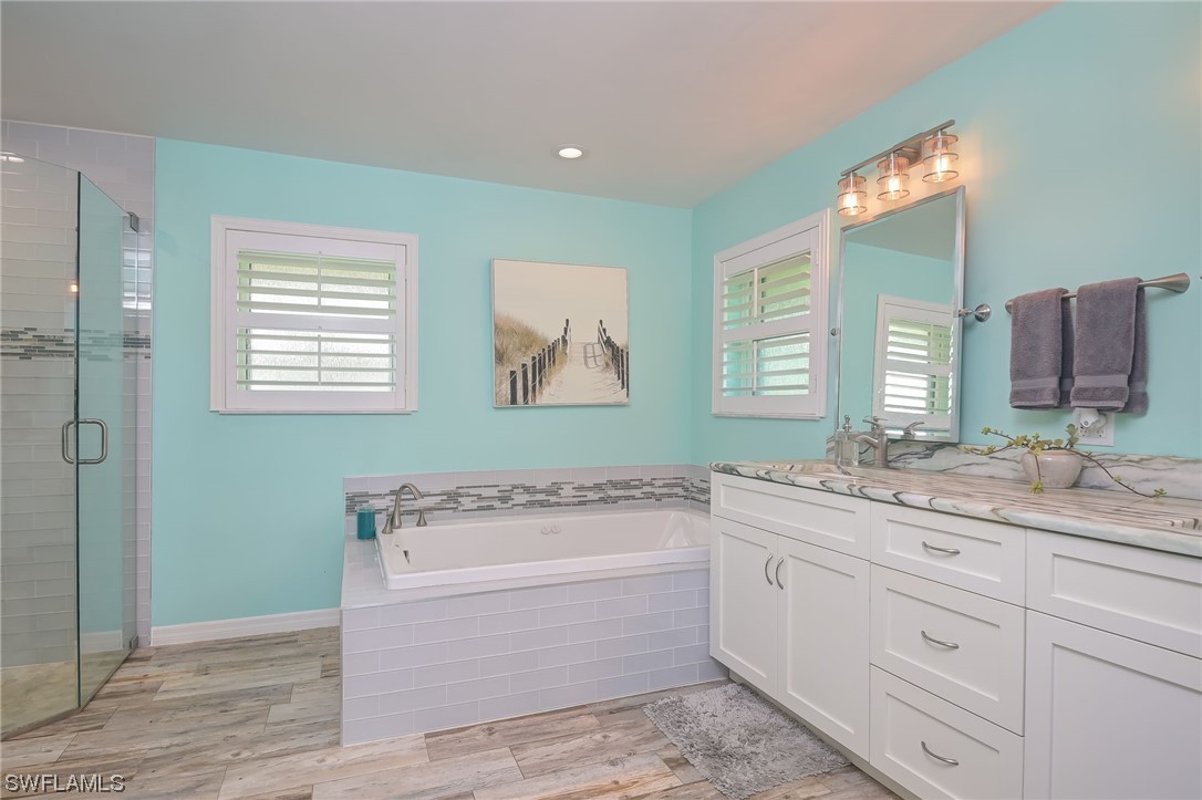 12614 River Road Fort Myers, FL 33905 - Photo 21 of 50 a bathroom with a granite countertop sink mirror and bathtub