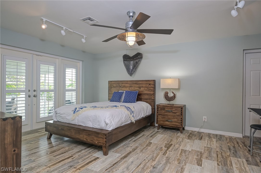 12614 River Road Fort Myers, FL 33905 - Photo 24 of 50 a bedroom with a bed and window