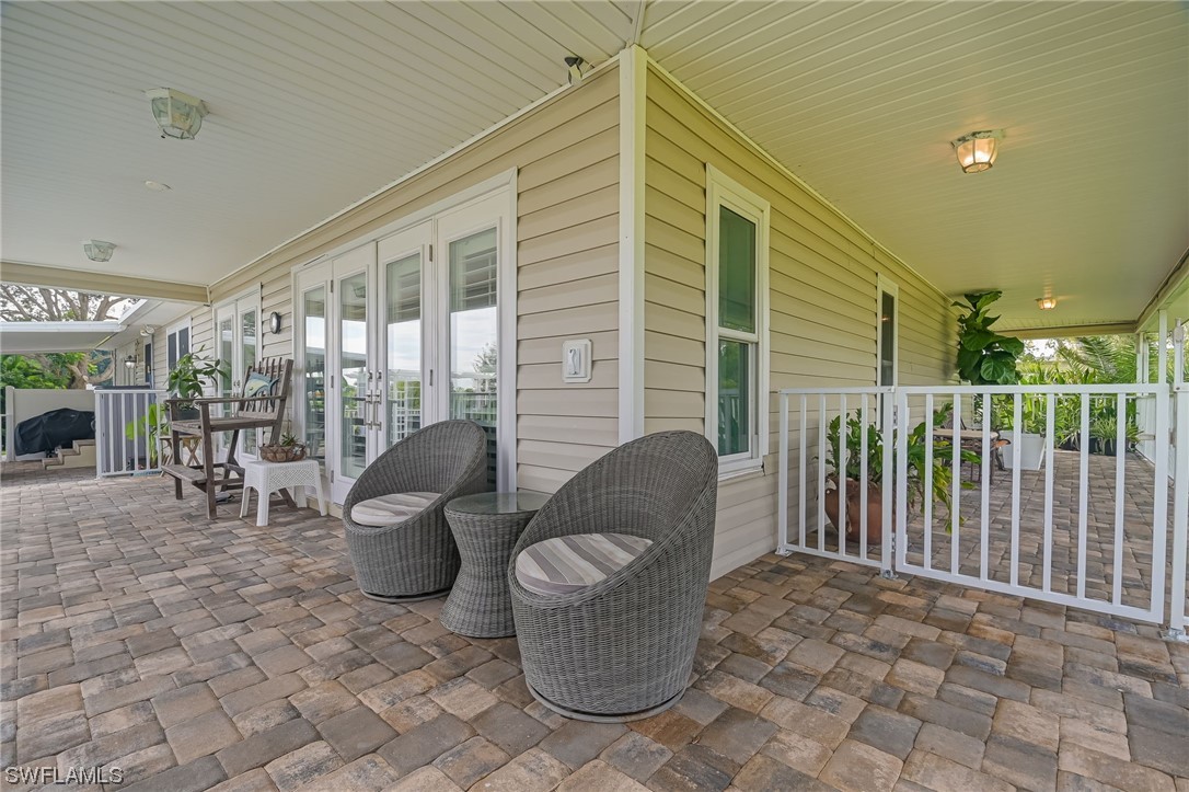12614 River Road Fort Myers, FL 33905 - Photo 25 of 50 a view of a patio with couches chairs and potted plants