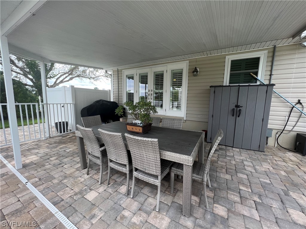 12614 River Road Fort Myers, FL 33905 - Photo 27 of 50 a dining room with furniture and outdoor space