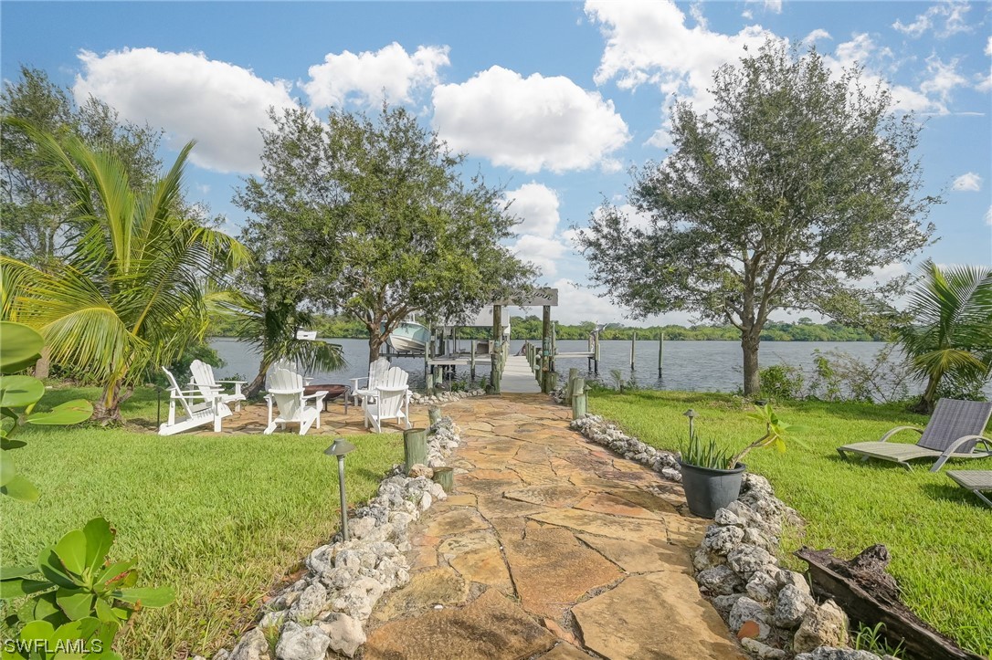 12614 River Road Fort Myers, FL 33905 - Photo 31 of 50 a view of a backyard with sitting area