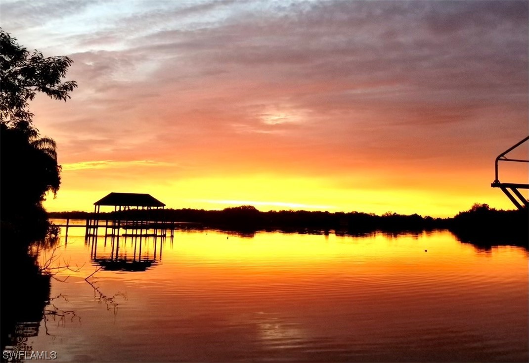 12614 River Road Fort Myers, FL 33905 - Photo 32 of 50 a view of lake with sunset