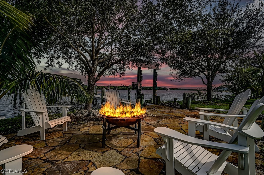 12614 River Road Fort Myers, FL 33905 - Photo 33 of 50 a view of a chairs and tables in the patio