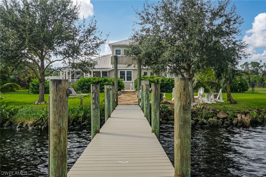 12614 River Road Fort Myers, FL 33905 - Photo 34 of 50 a front view of a house with a garden