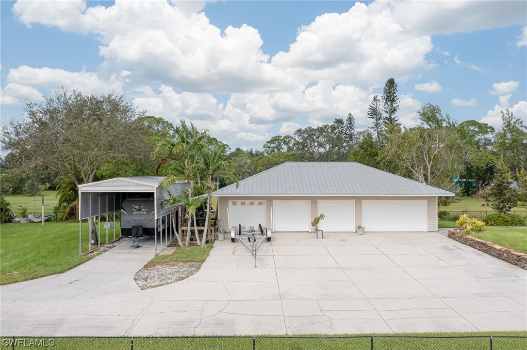 12614 River Road Fort Myers, FL 33905 - Photo 39 of 50 a view of house with yard and entertaining space