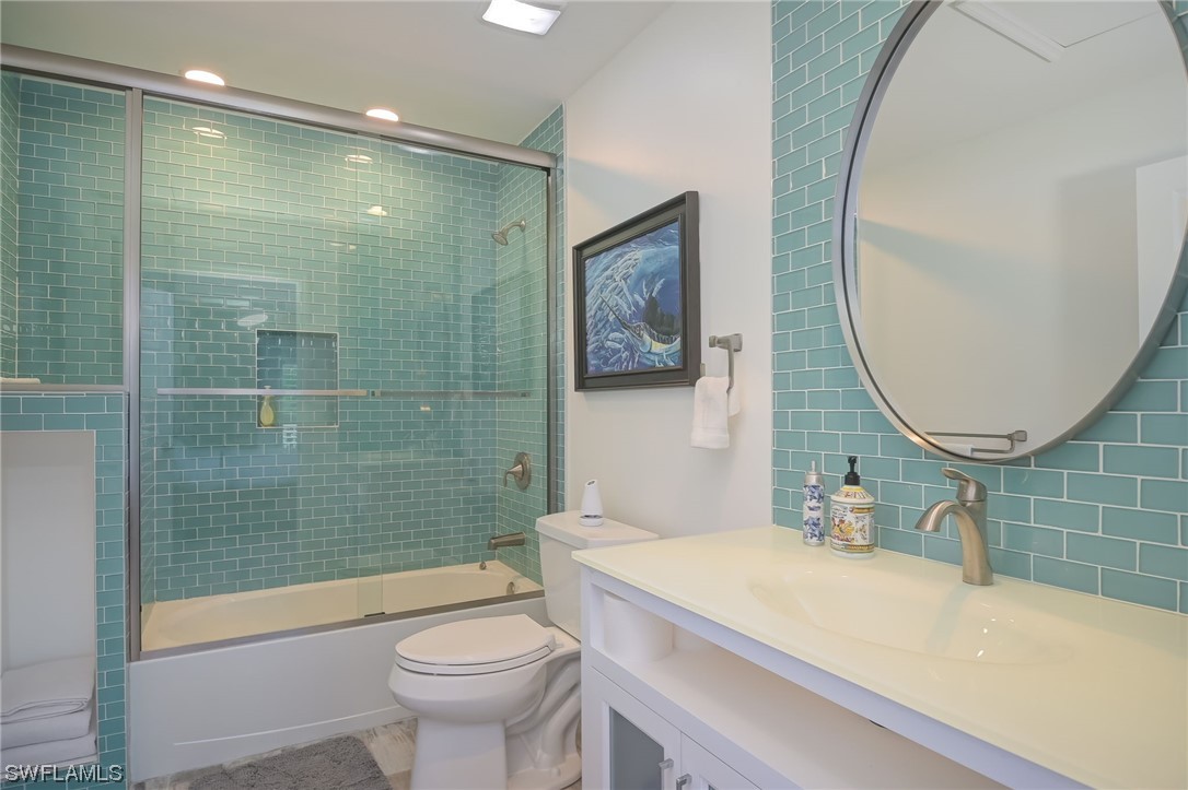 12614 River Road Fort Myers, FL 33905 - Photo 48 of 50 a bathroom with a sink a toilet and a mirror