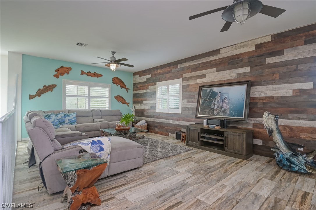12614 River Road Fort Myers, FL 33905 - Photo 9 of 50 a living room with furniture and a wooden floor