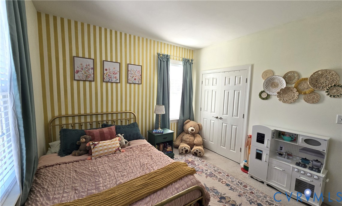 68 Fitzhugh Street White Stone, VA 22578 - Photo 23 of 26 a bedroom with a bed and a window