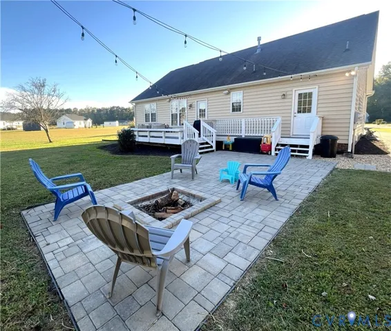 a view of a backyard with furniture porch and patio