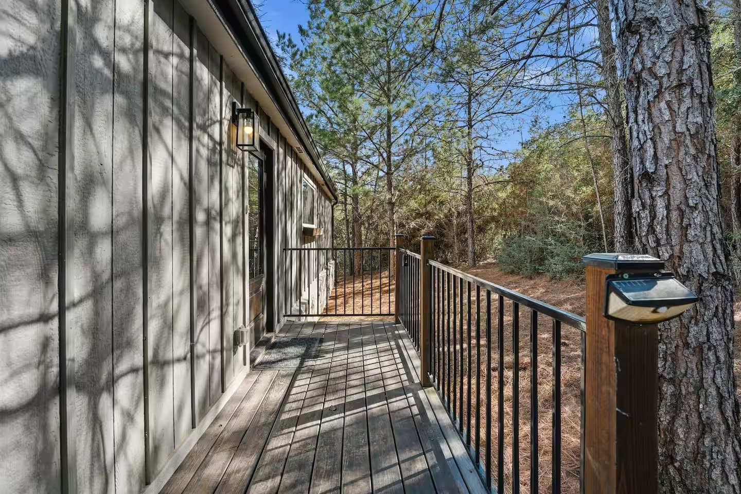 201 Winfield Thicket Road Bastrop, TX 78602 - Photo 34 of 36 a view of a balcony with wooden floor and fence
