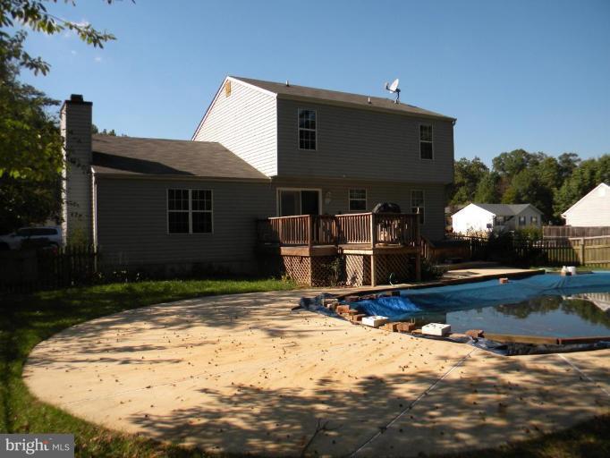 637 Riden Street Odenton, MD 21113 - Photo 2 of 19 Back deck leads to inground heated pool.