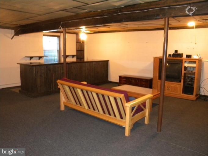 637 Riden Street Odenton, MD 21113 - Photo 16 of 19 Partially finished basement with built in bar!