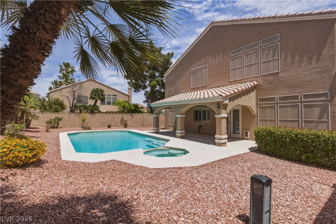 29 Olive Tree Henderson, NV 89074 - Photo 55 of 60 This outdoor oasis features a refreshing pool and a covered patio for ultimate relaxation.