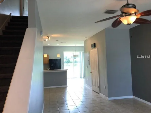 a view of a living room with a fireplace