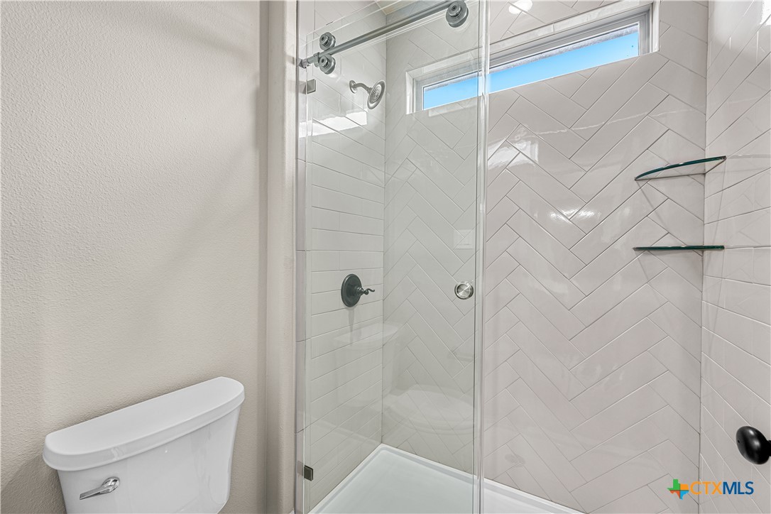 2136 Oak Draw Court Belton, TX 76513 - Photo 28 of 46 a bathroom with a shower and toilet