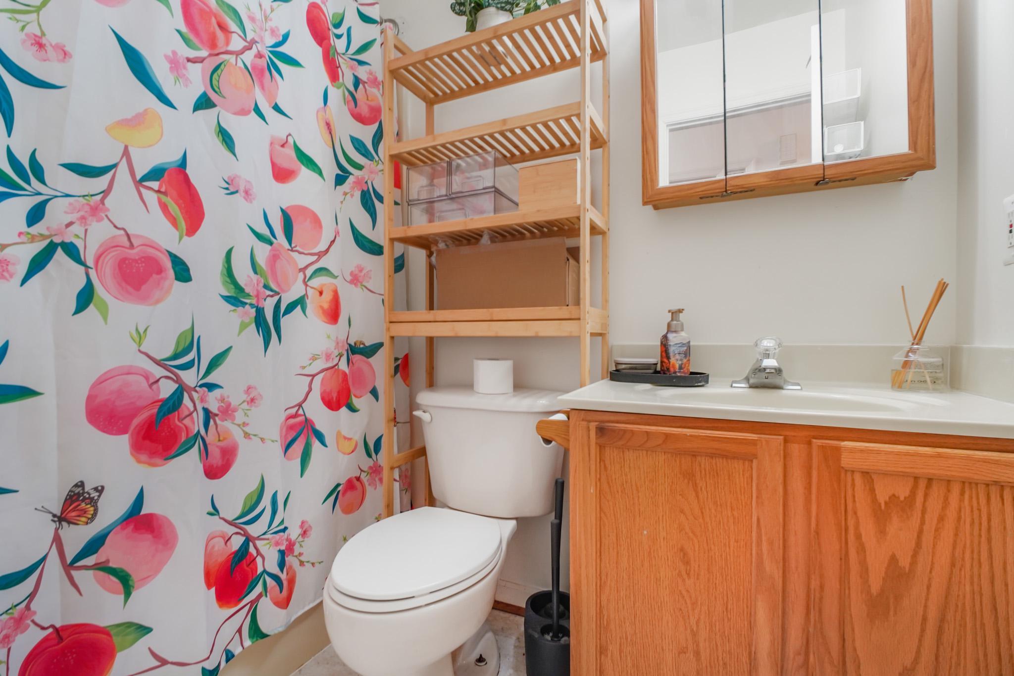 213 12th Street Colonial Beach, VA 22443 - Photo 13 of 31 Charming bathroom with floral accents.