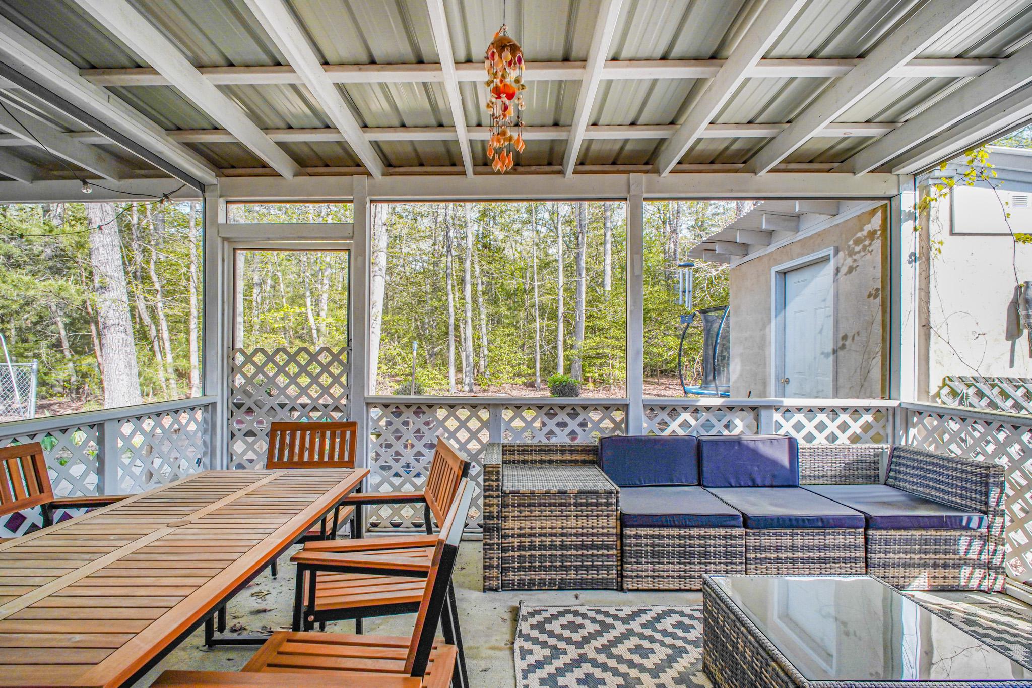 213 12th Street Colonial Beach, VA 22443 - Photo 15 of 31 Serene screened porch with nature views.