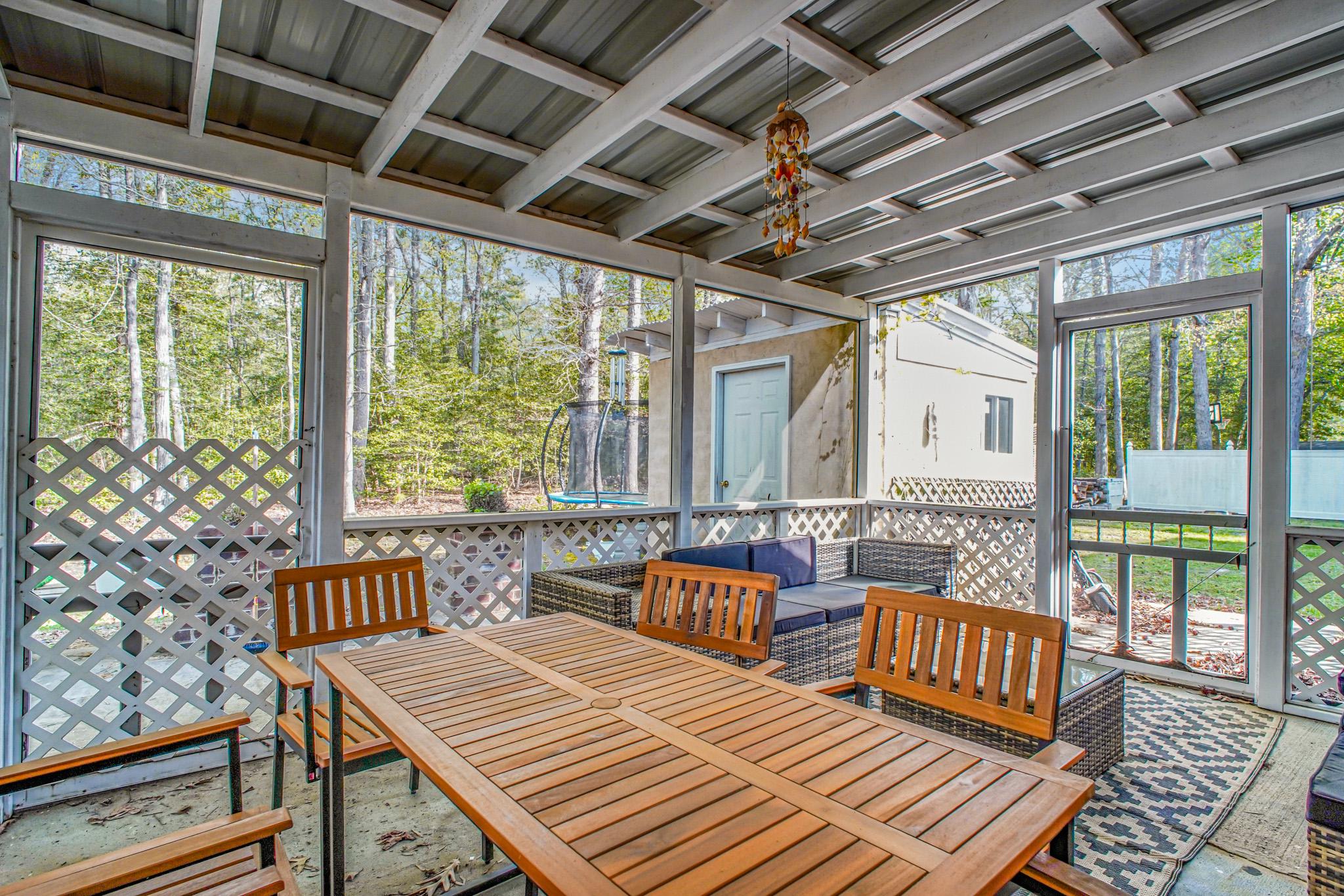 213 12th Street Colonial Beach, VA 22443 - Photo 16 of 31 Serene screened porch retreat.