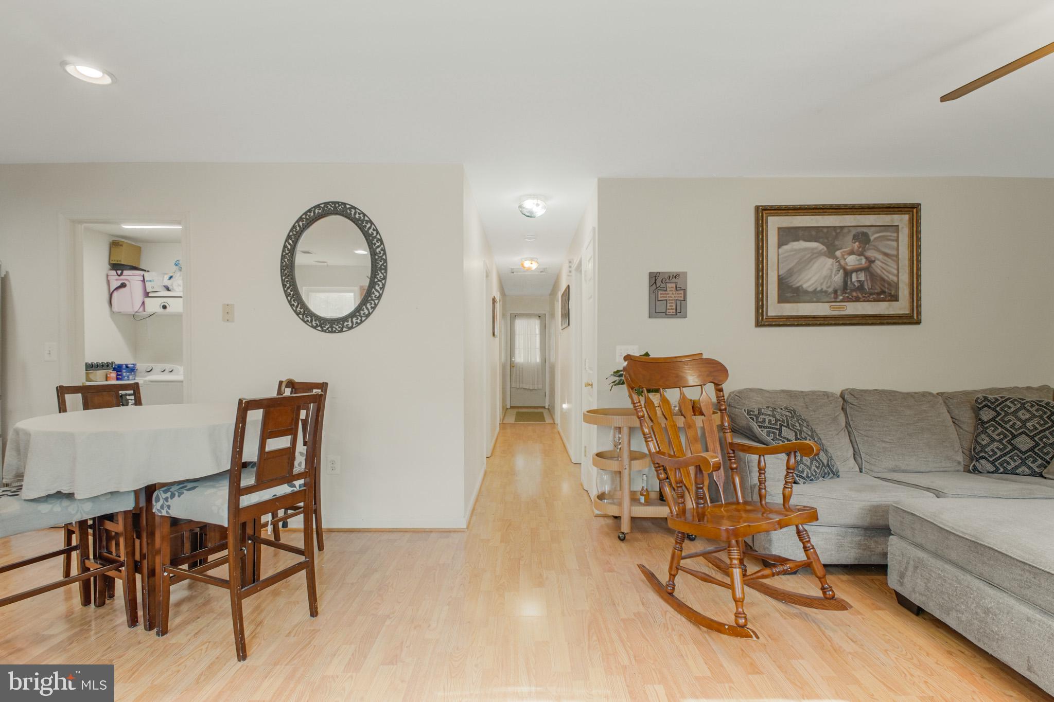 213 12th Street Colonial Beach, VA 22443 - Photo 5 of 31 Inviting open layout with warm tones.