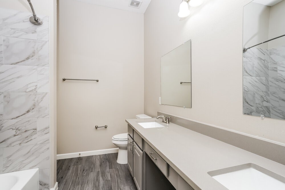 8911 Cypress Square Drive Spring, TX 77379 - Photo 14 of 16 a bathroom with a sink and a toilet