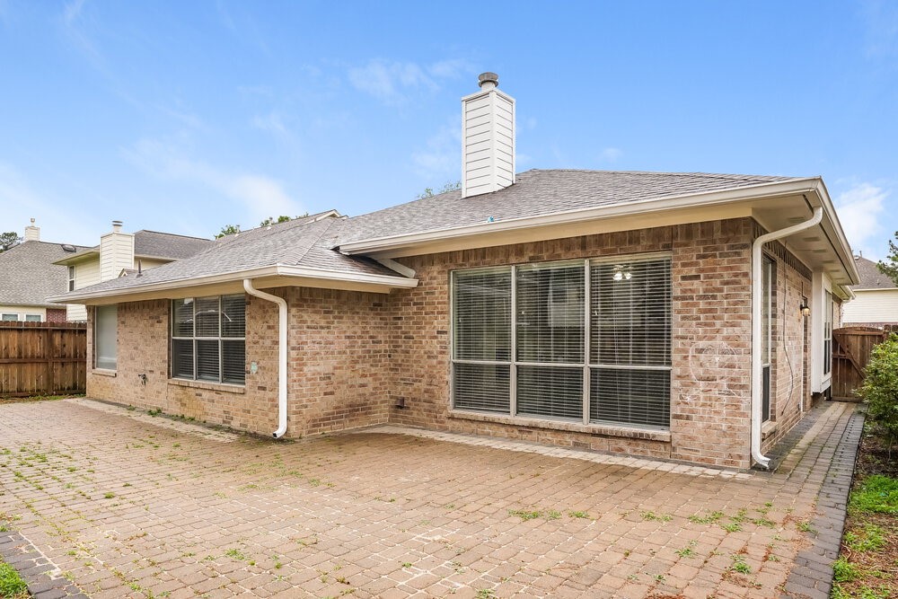 8911 Cypress Square Drive Spring, TX 77379 - Photo 16 of 16 a front view of a house with a yard and garage