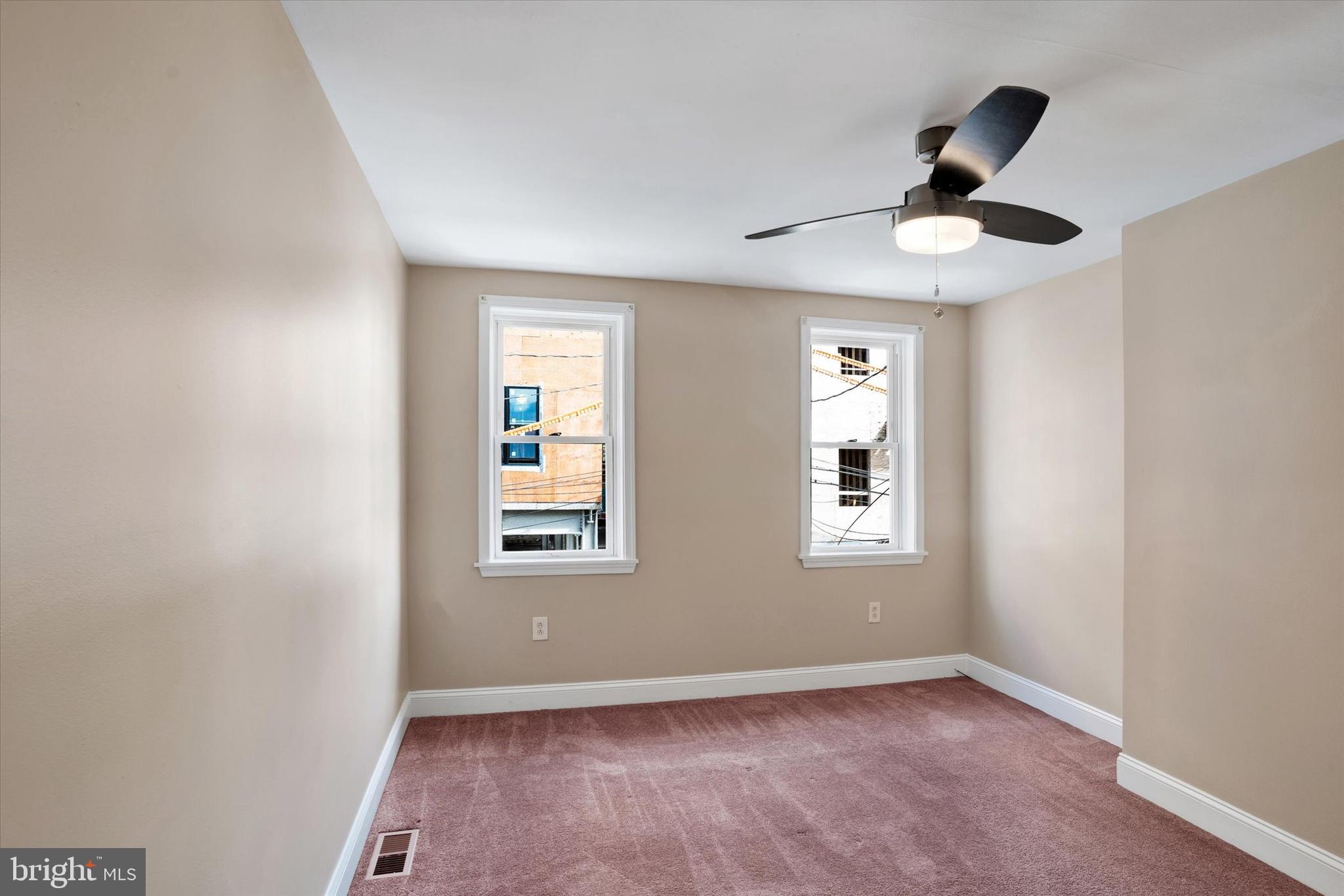 2010 East Boston Street Philadelphia, PA 19125 - Photo 19 of 25 an empty room with windows and fan