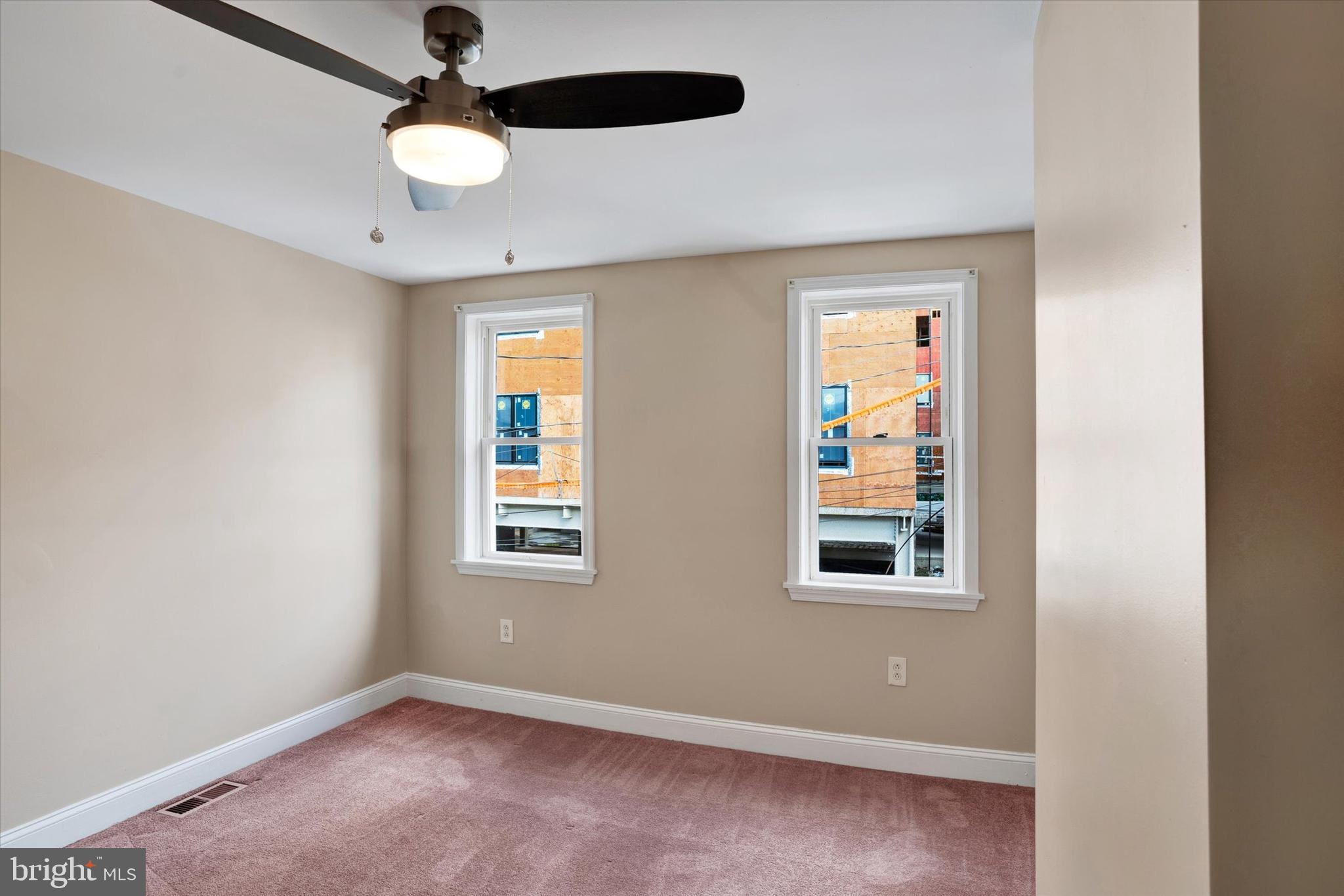2010 East Boston Street Philadelphia, PA 19125 - Photo 20 of 25 an empty room with windows and fan