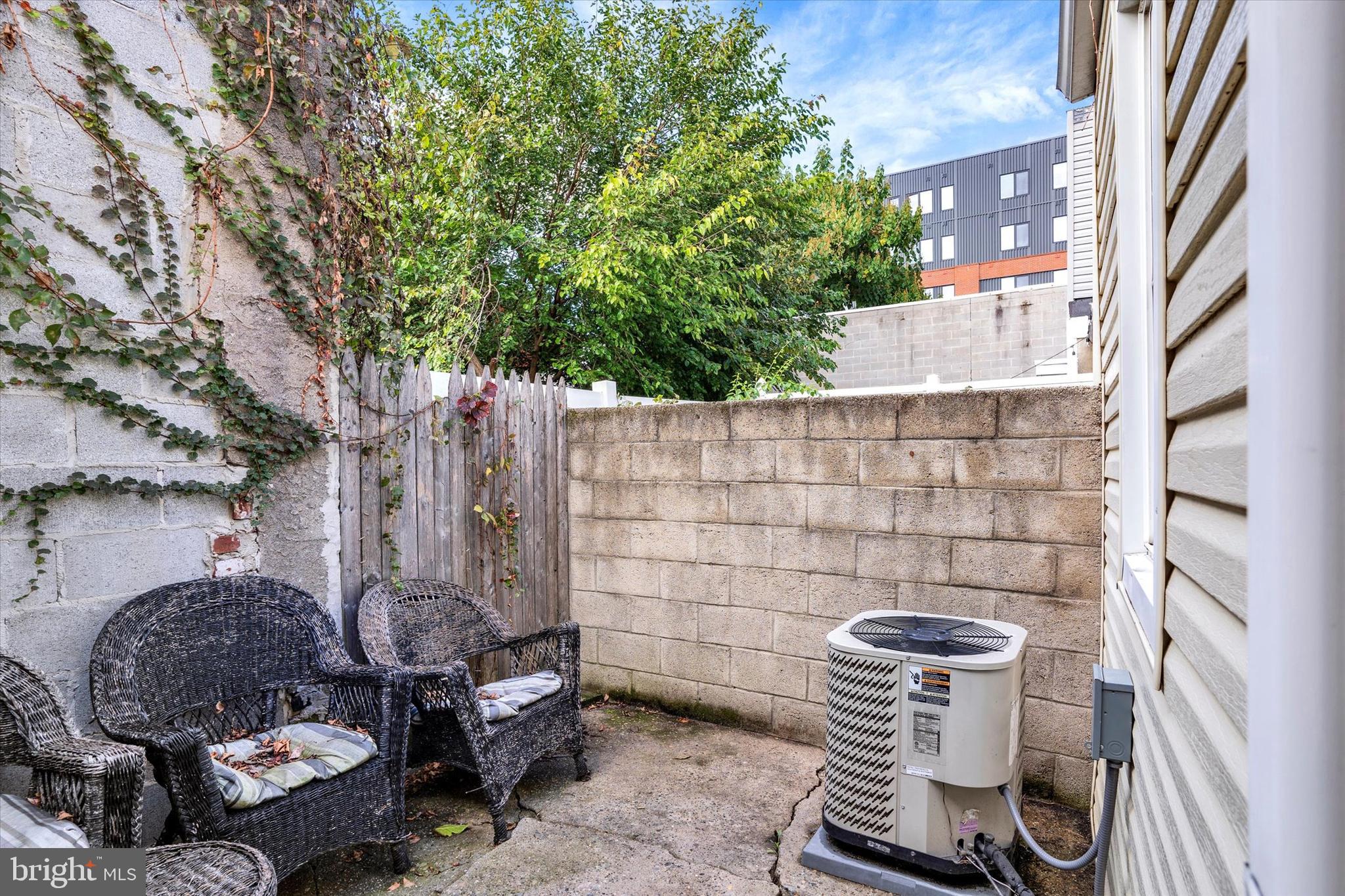 2010 East Boston Street Philadelphia, PA 19125 - Photo 25 of 25 a backyard of a house with barbeque oven fire pit and outdoor seating