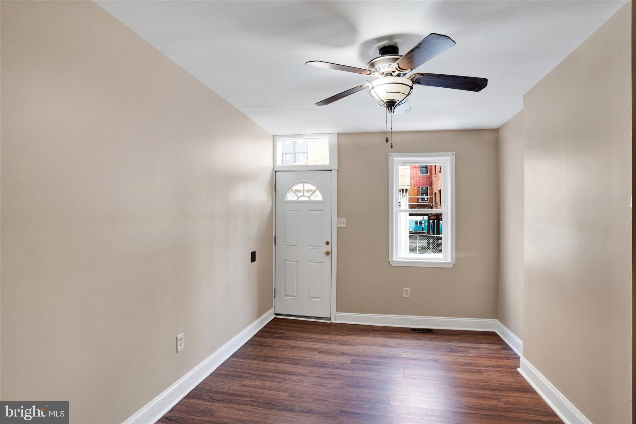 2010 East Boston Street Philadelphia, PA 19125 - Photo 3 of 25 wooden floor in an empty room with a window