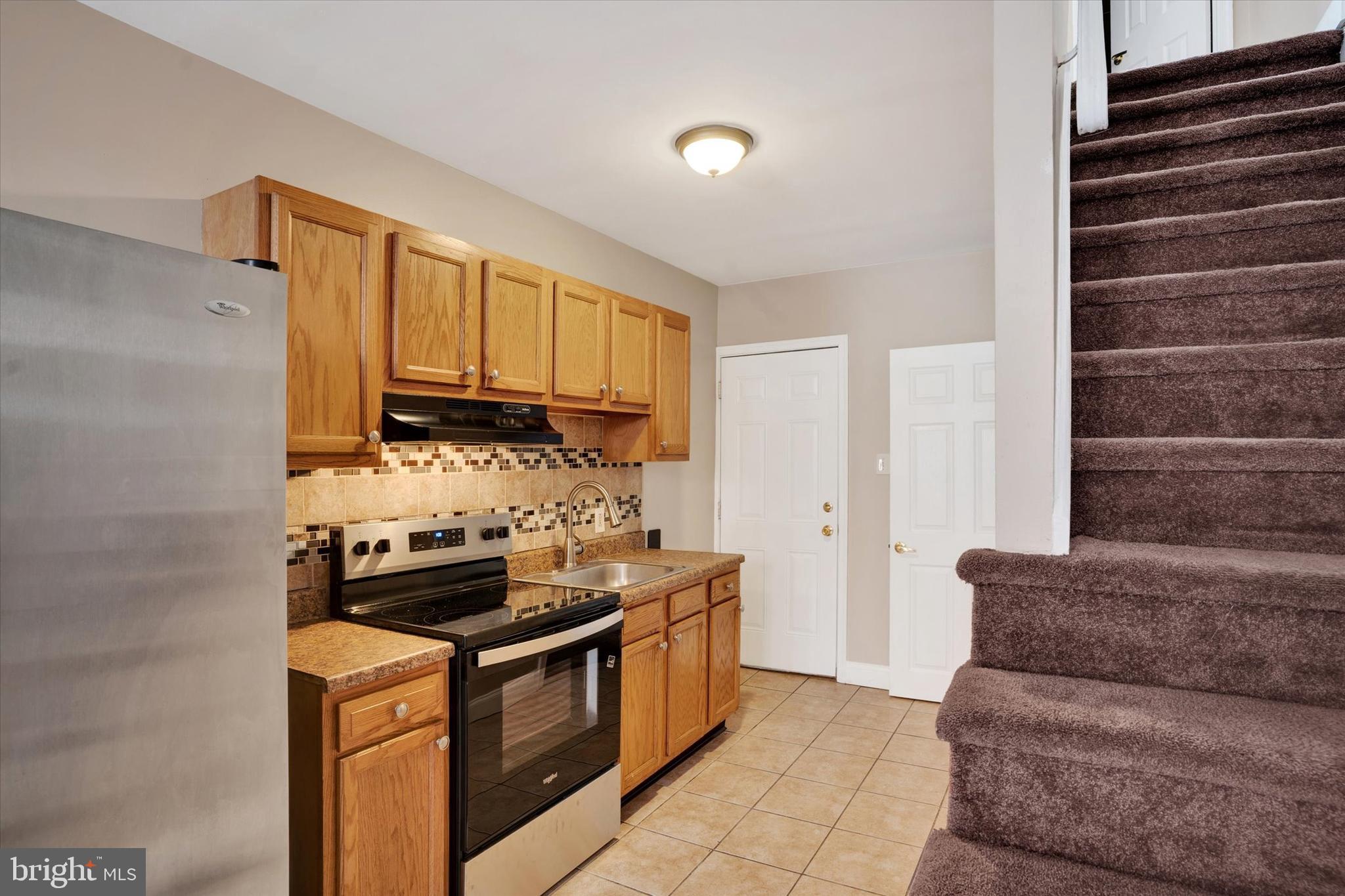 2010 East Boston Street Philadelphia, PA 19125 - Photo 7 of 25 a kitchen with stainless steel appliances granite countertop a stove and a refrigerator