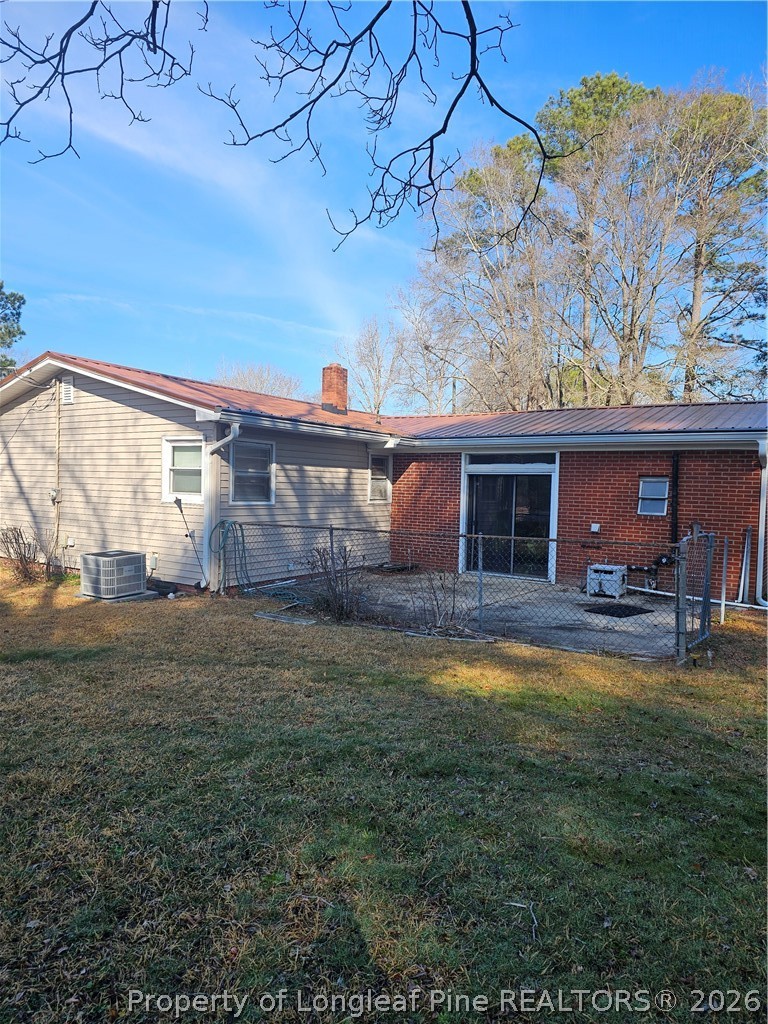 2133 Al Ray Road Fayetteville, NC 28312 - Photo 4 of 6 a view of a house with backyard and sitting area