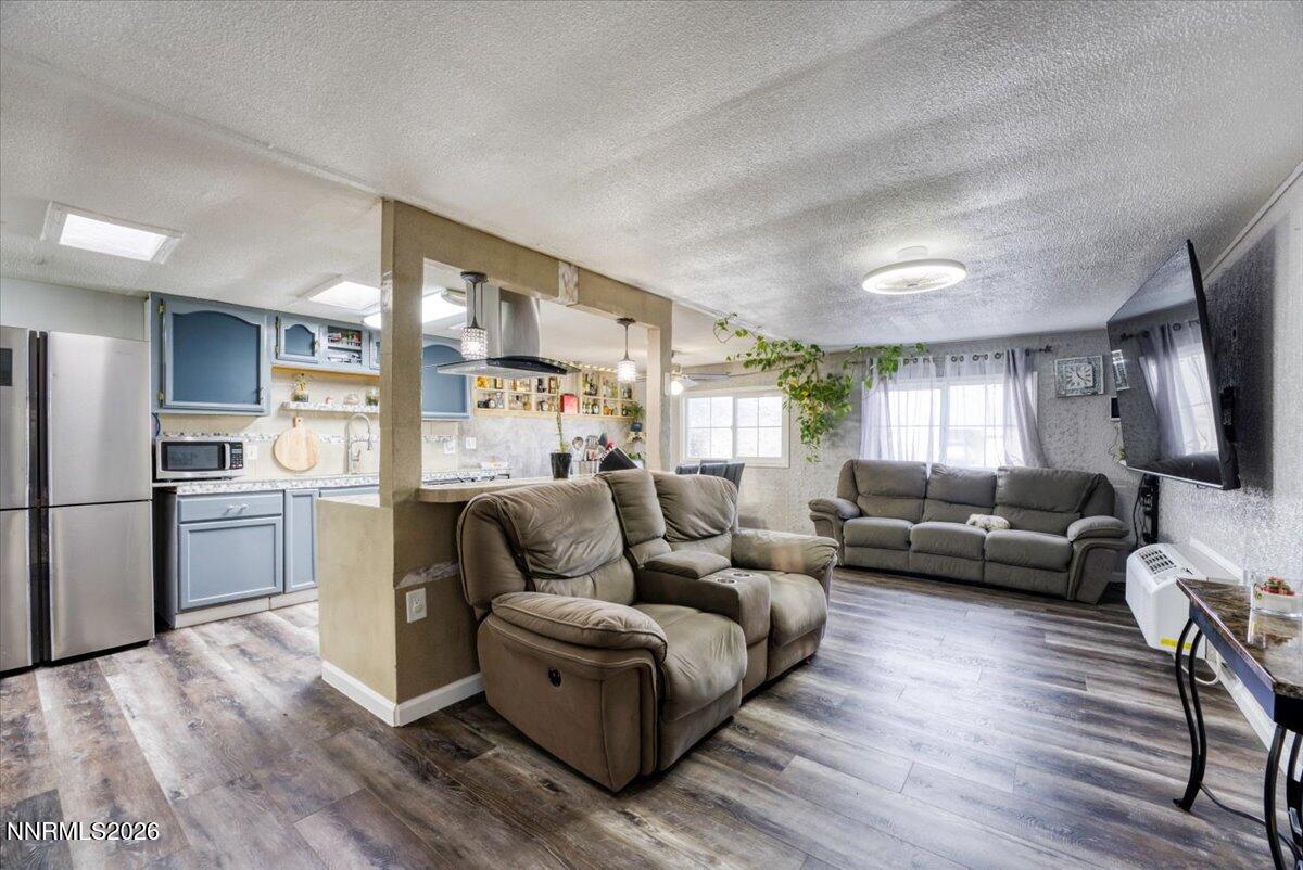 985 Villa Way Fernley, NV 89408 - Photo 3 of 37 a living room with furniture and a large window