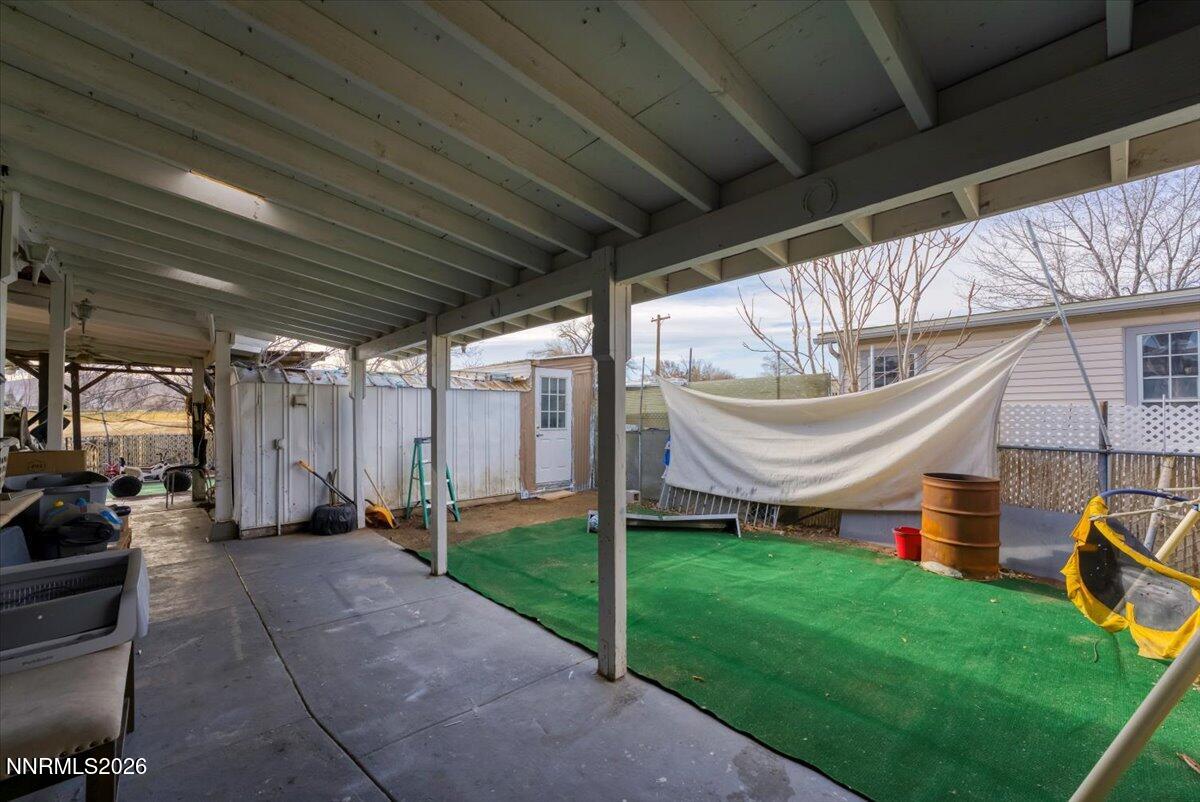 985 Villa Way Fernley, NV 89408 - Photo 33 of 37 a view of a porch with couches chairs and a yard