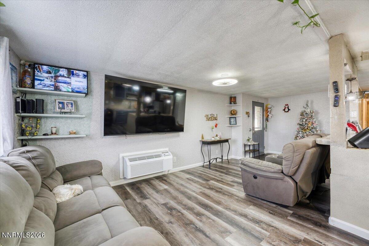 985 Villa Way Fernley, NV 89408 - Photo 5 of 37 a living room with furniture and a flat screen tv