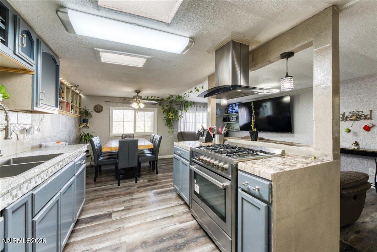 985 Villa Way Fernley, NV 89408 - Photo 9 of 37 a kitchen with stainless steel appliances granite countertop a stove and a sink