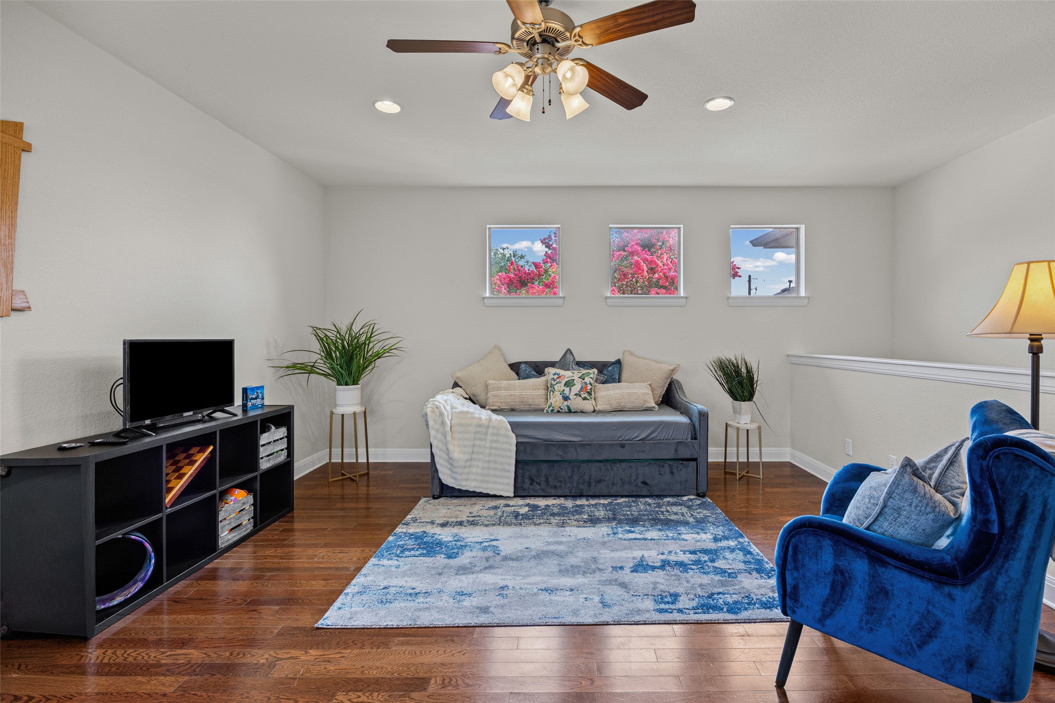 6708 Menchaca Road, Unit 10 Austin, TX 78745 - Photo 14 of 30 Spacious great room featuring wood-finish flooring, recessed lighting, and multiple windows for great natural light!