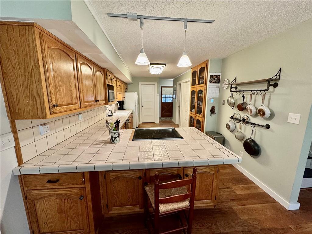 1012 King Mill Road McDonough, GA 30252 - Photo 13 of 64 a view of a kitchen with kitchen island a counter space a sink appliances and cabinets