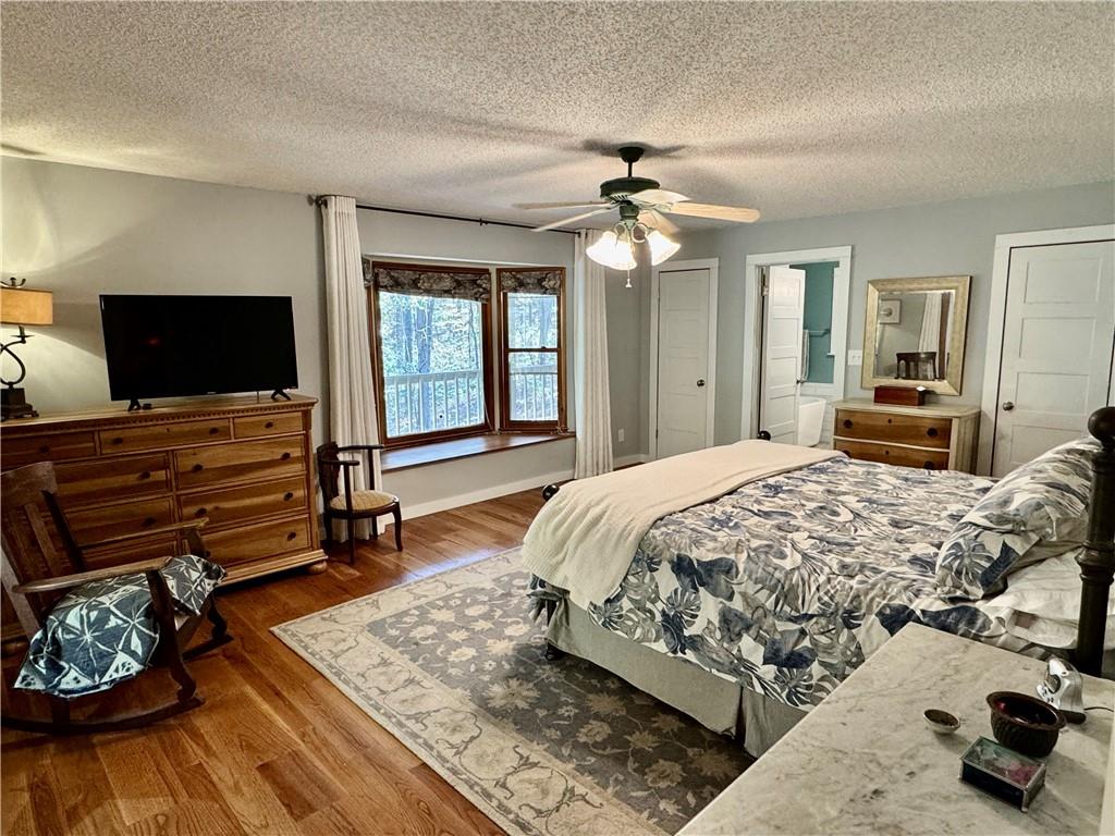 1012 King Mill Road McDonough, GA 30252 - Photo 17 of 64 a spacious bedroom with a bed and a flat screen television